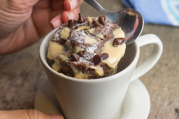 Mug cake with chocolate close up