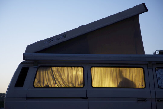 Silhouette of Person Inside Camper