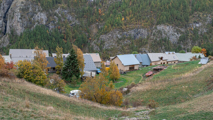 Autumn landscape in the mountains on hike from the hamlet of Les Cours to Lac du Pontet and back, near Villar d'Arene and Col du Lautaret, Hautes-Alpes, France