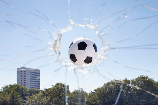 Soccer Ball Smashing through Window