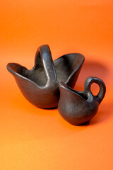 Ceramic jugs of dark material 