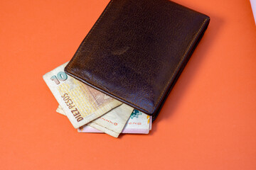 Leather wallet with money in cash