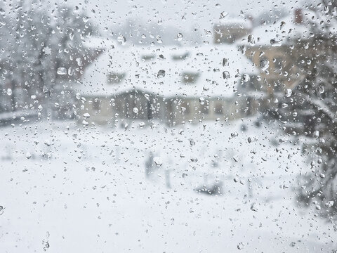 A view of the city from the window on a snowy winter day. © Bargais
