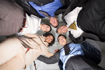 Group Portrait of Business People in Huddle