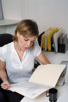 Businesswoman Looking at Documents