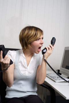 Businesswoman Using Telephone