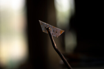 Steel part. Blade on stick. Welded part. Rusty metal.