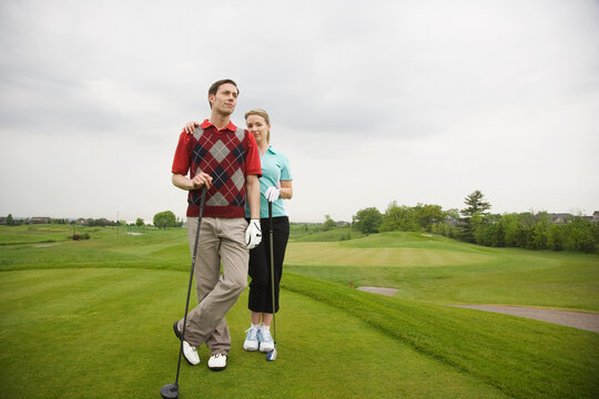 Portrait of Couple Standing on Golf Course