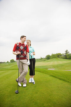 Couple Standing on Golf Course