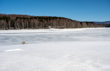A boat on a frozen lake. Frozen Lake  in Winte
