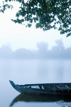 Canoe in Morning Mist at Sras Srang, Angkor, Cambodia