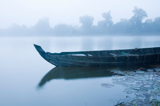 Canoe in Morning Mist at Sras Srang, Angkor, Cambodia