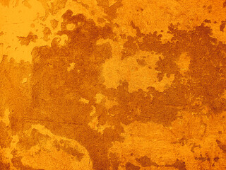 Grunge wall with peeling plaster vintage orange color texture background.