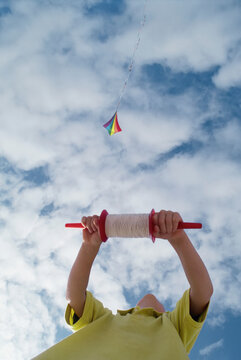 Looking Up at Boy Flying Kite South Beach, Oregon, USA