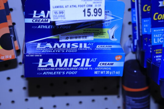 LAMISIL in boxes on a shelf at a supermarket.
