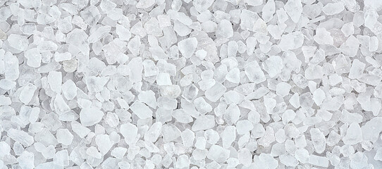 Large sea white salt as background, top view. Sea salt texture.