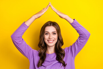 Fototapeta na wymiar Photo of young bleaching smiling woman hands showing roof safety against problems stay home indoors isolated on bright yellow color background