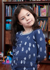 beautiful young girl posing for a picture in her pajamas