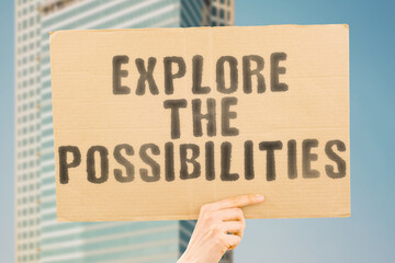 The phrase " Explore the Possibilities " is on a banner in men's hands with blurred background. Career. Direction. Motivation. Chance. Idea. Opportunity. Way. Choice. Decision. Different. Guide. Job