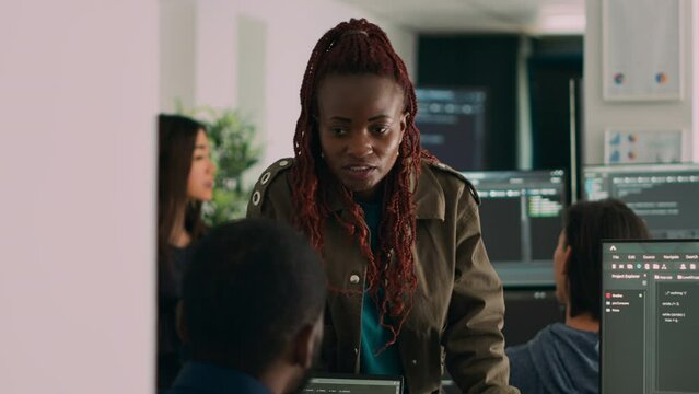 Software engineers analyzing source code and database, brainstorming ideas to develop new security system. Programmers working with coding language collaborating on group project.