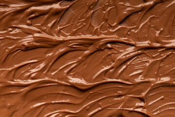 Chocolate background. Melted chocolate. Chocolate swirl.