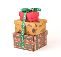 Group of different christmas gift boxes isolated on white background. Colored christmas gift boxes with green ribbon.