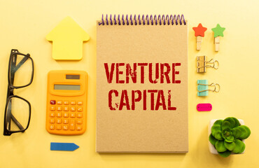 VC venture capital abbraviation symbol. Concept words VC venture capital on white note. Metallic pen.