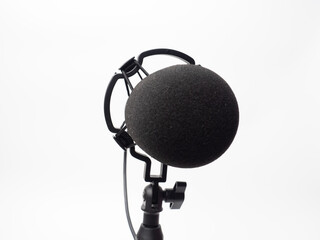 Picture of a black condenser microphone on a white isolated background
