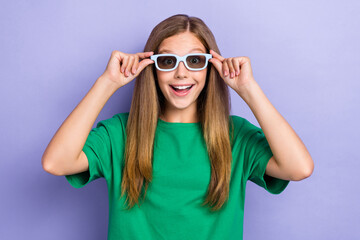 Photo of cheerful glad lady hold spectacled watching comedy film isolated on purple color background