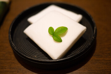 wet towel with leaf on the wooden plate