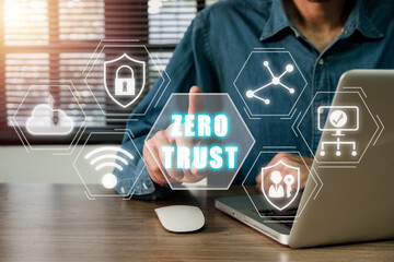 Zero trust security concept, Person using computer with zero trust icon on virtual screen.