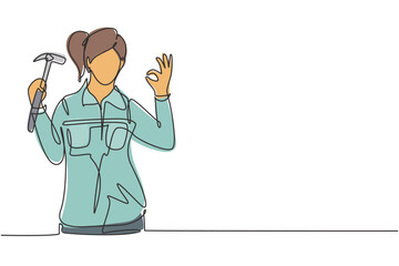 Single one line drawing female carpenter with gesture okay works in his workshop making wooden products. Skills in using carpentry tools. Modern continuous line draw design graphic vector illustration