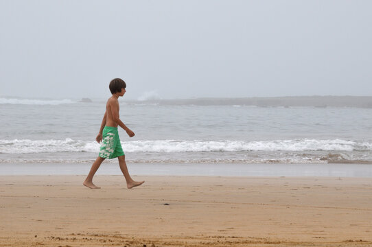 Boy Walking on Beach, Rabat, Morocco