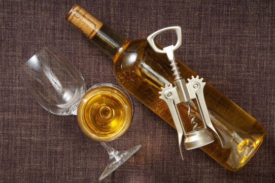 Overhead View of Bottle of White Wine, Wine Glasses and Corkscrew