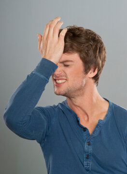 Man Hitting Forehead