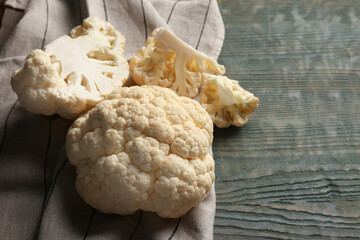 Fresh raw cauliflower on light blue wooden table