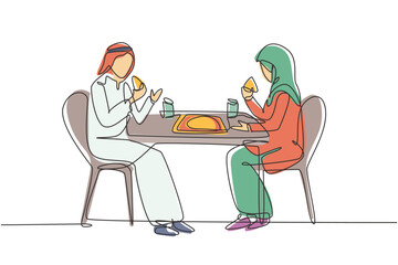 Single one line drawing young Arabian couple husband and wife having cake meal around table. Celebrate wedding anniversary with romantic dinner. Continuous line draw design graphic vector illustration