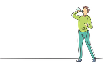 Continuous one line drawing young Arab man standing and drinking fresh water from bottle with his right hand after exercising. Healthy lifestyles. Single line draw design vector graphic illustration