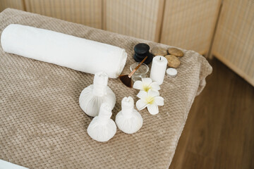 Spa accessories with herbal compressing ball in spa room.