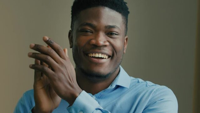 African american happy emotional man winner office worker male businessman clapping hands celebrate victory congratulation gesture applauding approve business idea good result thumb up respect symbol