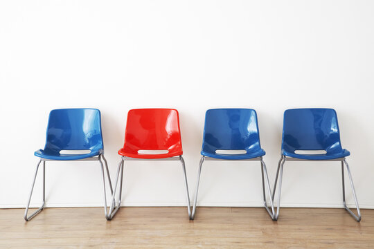 Row of Red and Blue Chairs in Waiting Room