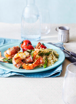 Prosciutto wrapped Shrimp with Orzo and Asparagus and Tomatoes