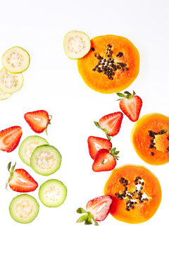 Sliced Papaya, Guava, and Strawberries, studio shot on white background