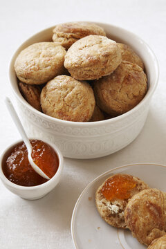 Bowl of cheese biscuits with red pepper jelly