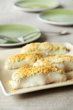 Panko crusted white fish pieces on a serving platter