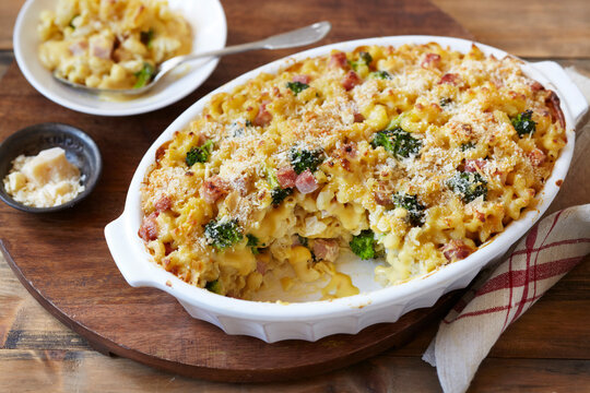 Baked macaroni and cheese cassserole with broccoli, ham and parmesan cheese