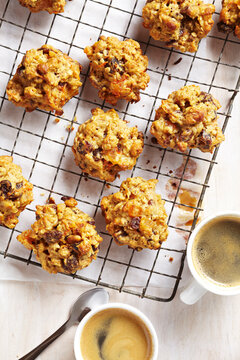 Breakfast cookies on a cooling rack with cups of espresso