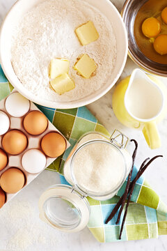 Cake ingriedents on a marble countertop, ready for baking