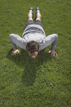 Man Doing Push-ups Outdoors