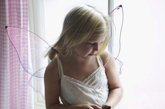 Young Girl Wearing Fairy Wings